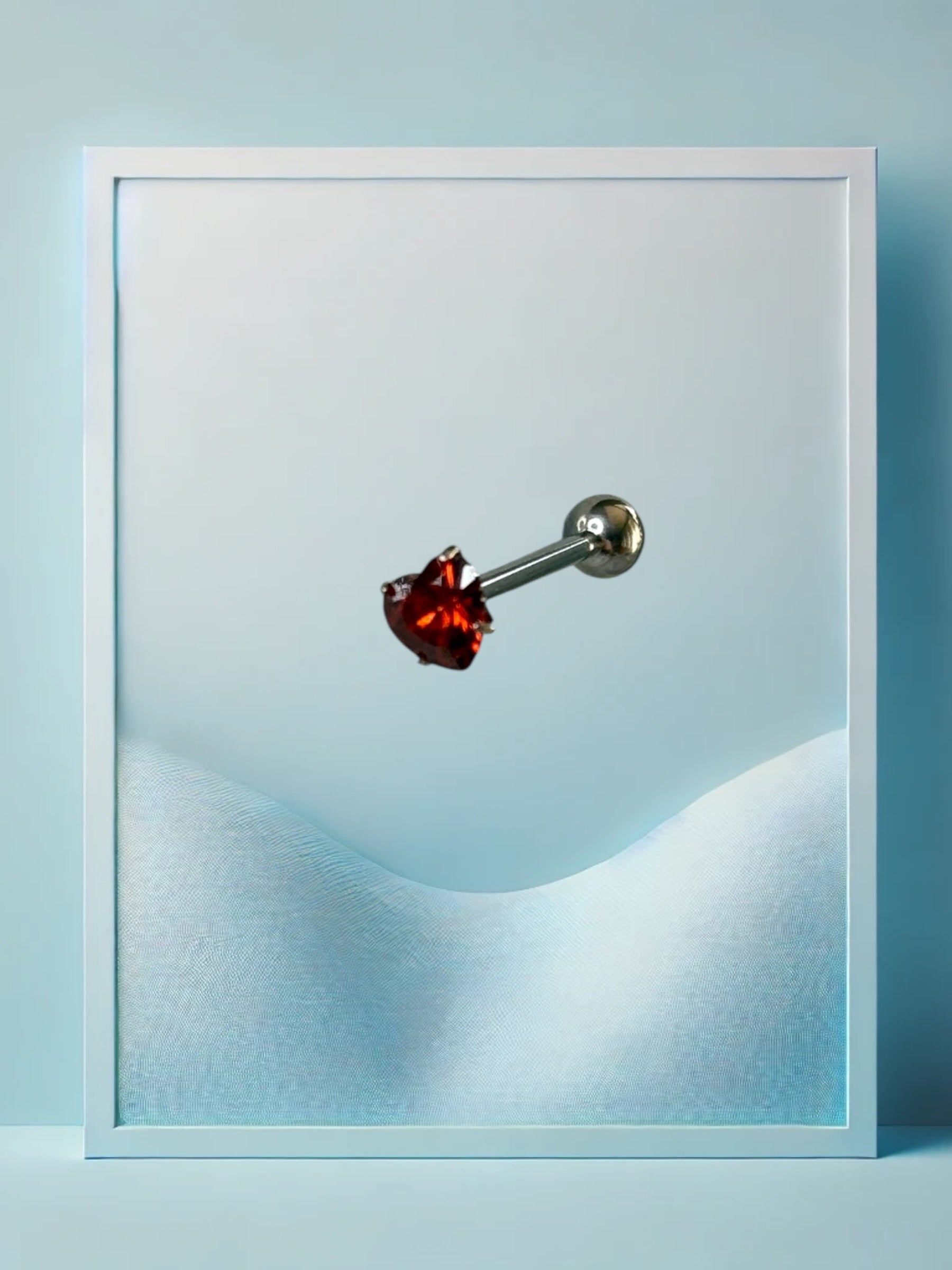 Piercing alla lingua a forma di cuore rosso