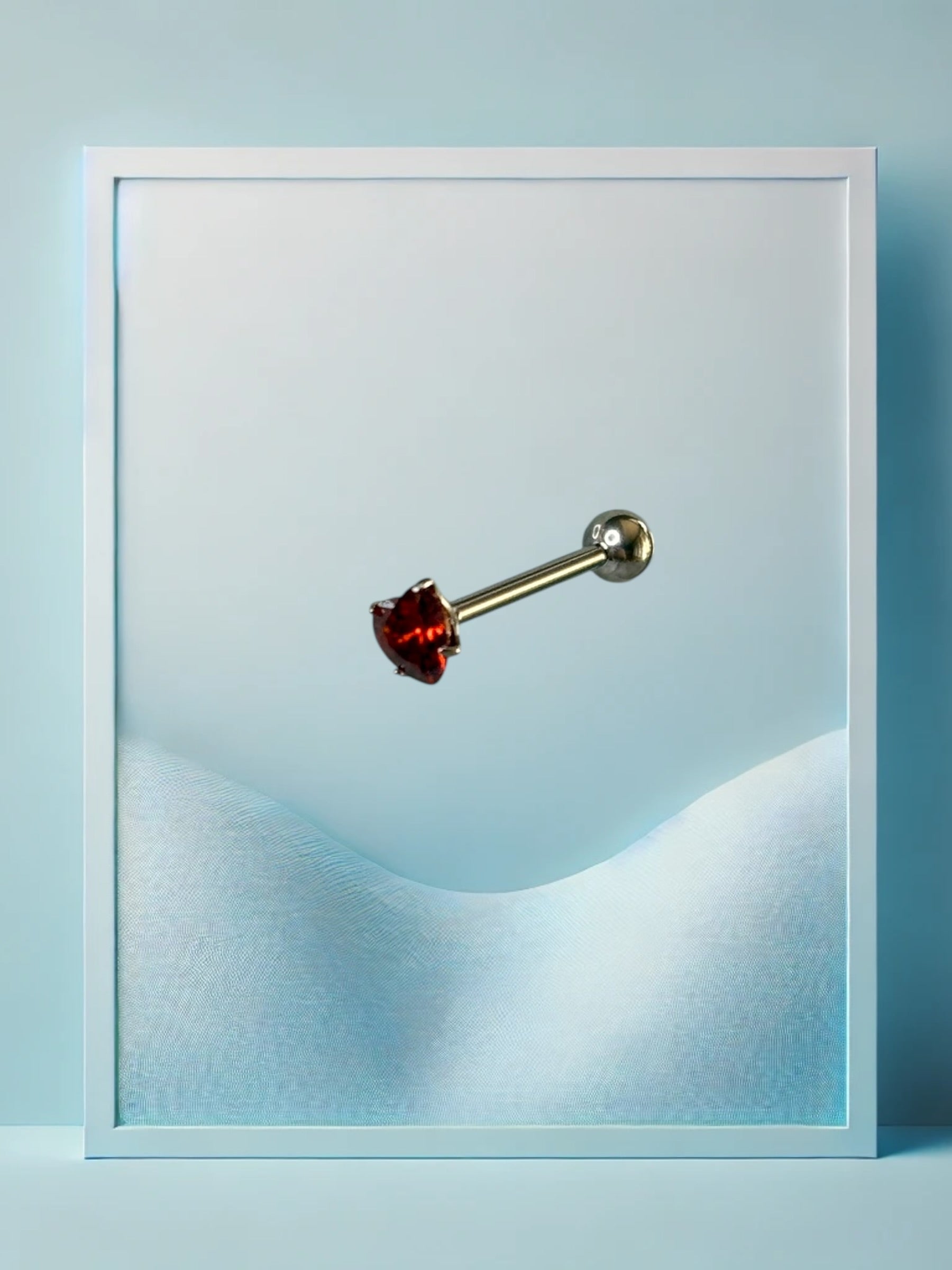 Piercing alla lingua a forma di cuore rosso